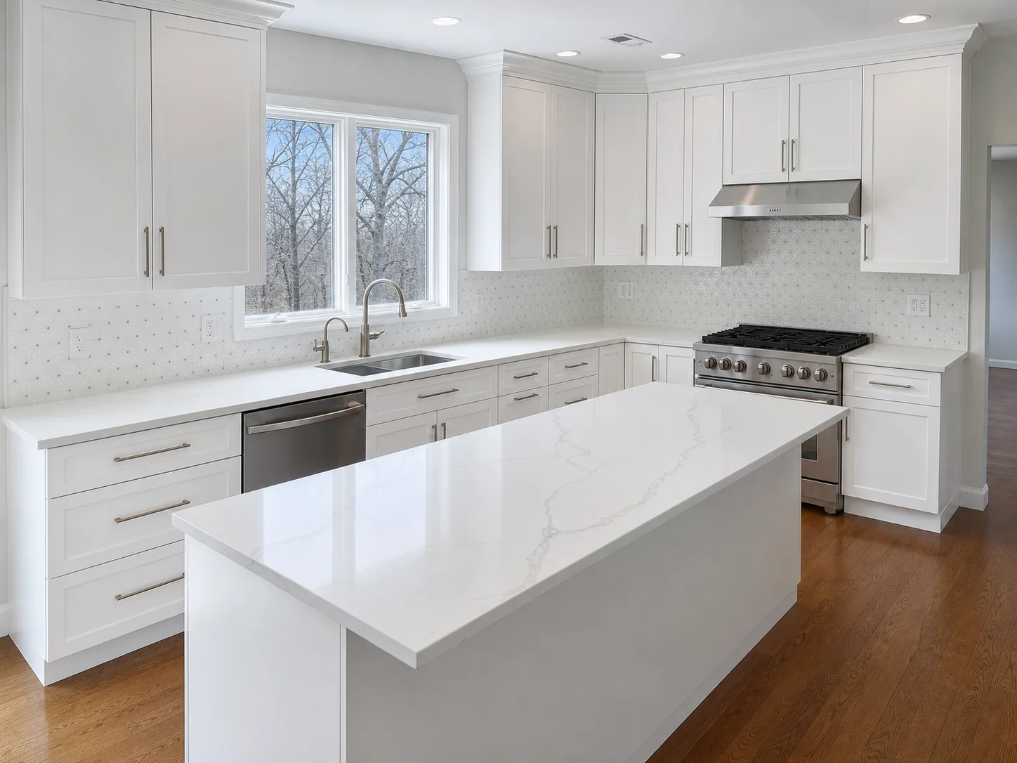 White custom kitchen cabinetry and island built by HUFCO